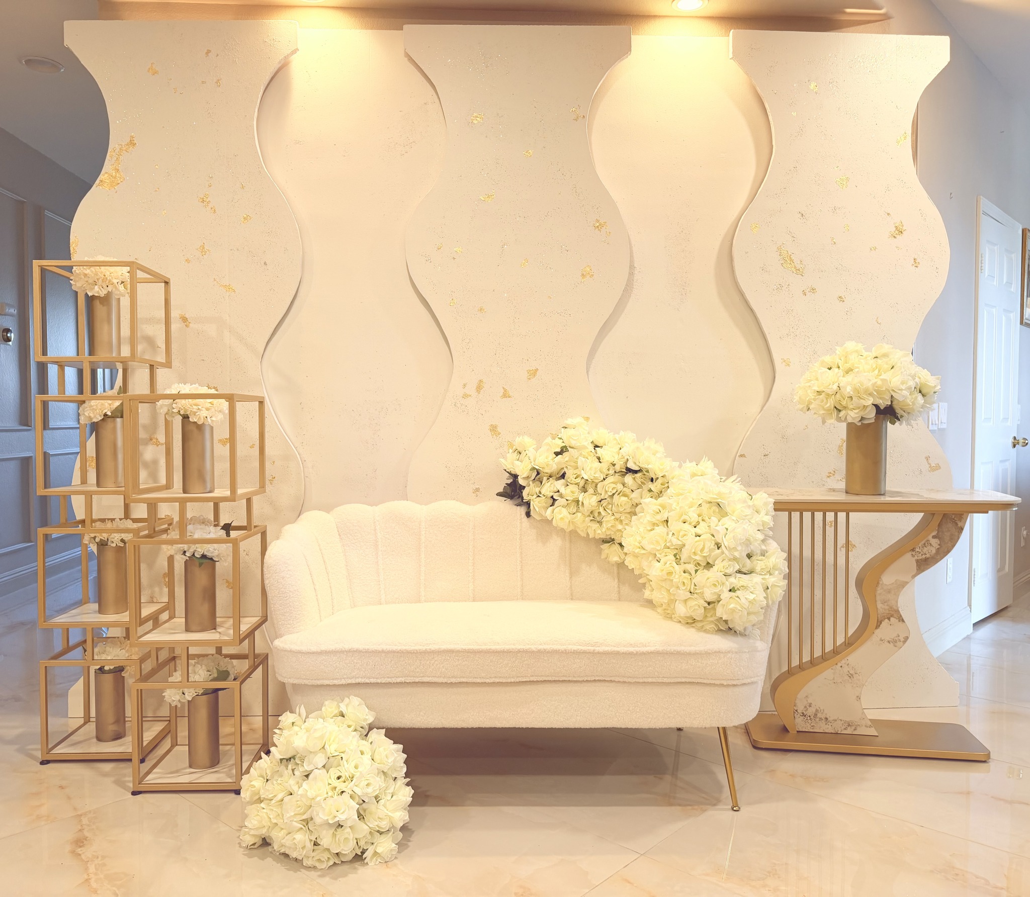Signature wavy backdrop with gold accents